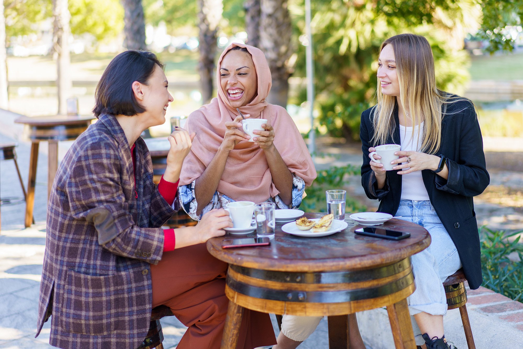 delighted diverse women drinking coffee 2022 03 16 00 16 42 utc